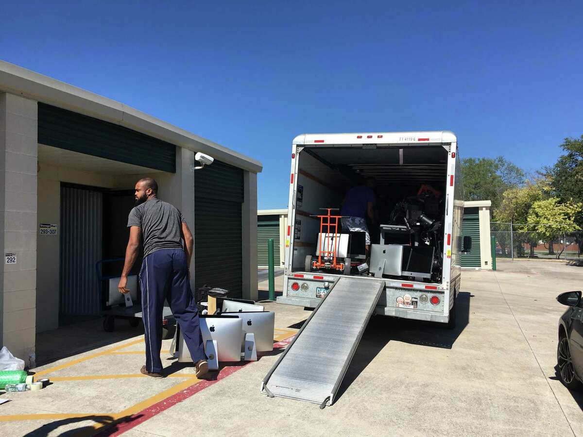 Computers, musical instruments and other property from the closed-down San Antonio School for Inquiry and Creativity — items that state officials had accused the school’s former board president of stealing last August — are loaded on a truck Wednesday to be taken to charter schools hurt by Tropical Storm Harvey in Houston.