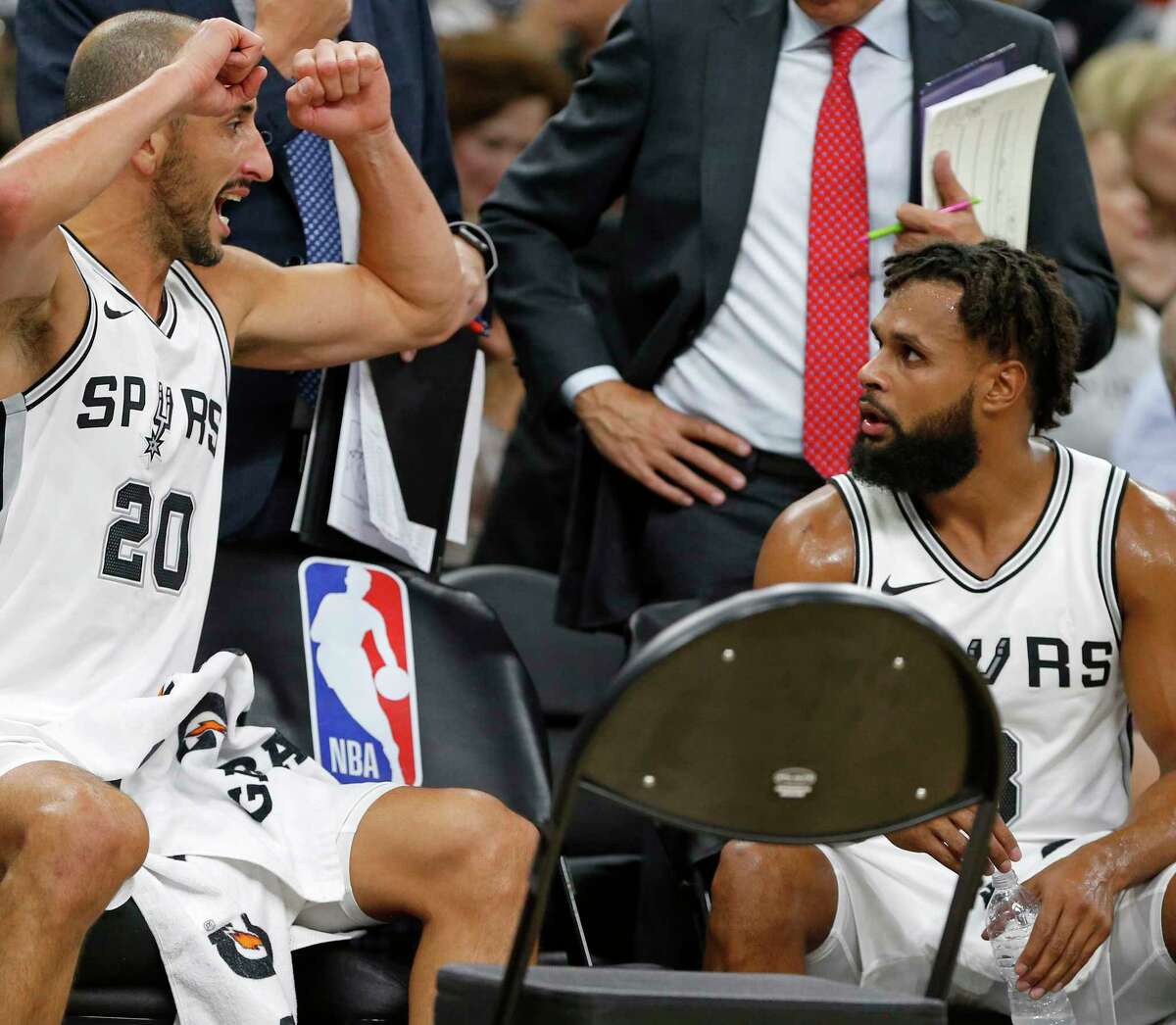 San Antonio Spurs?• Manu Ginobili talks with Patty Mills on the bench during a second half timeout against the Toronto Raptors Monday Oct. 23, 2017 at the AT&T Center. The Spurs won 101-97.