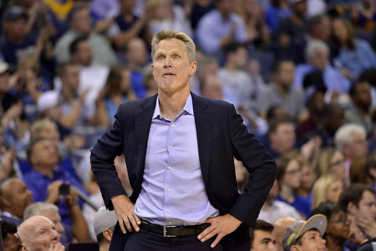 Golden State Warriors head coach Steve Kerr stands on the court in the second half of an NBA basketball game against the Memphis Grizzlies Saturday, Oct. 21, 2017, in Memphis, Tenn. (AP Photo/Brandon Dill)