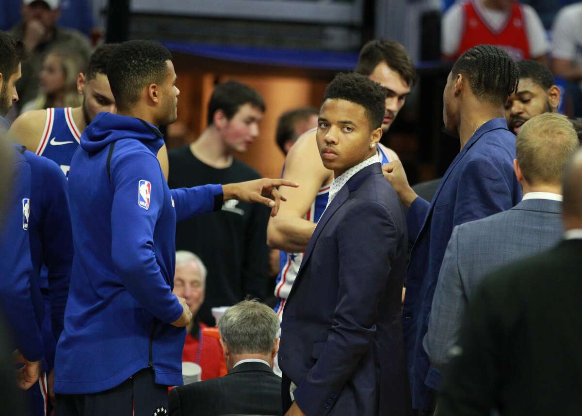 The Philadelphia 76ers' Markelle Fultz, middle, did not dress for the game against the Houston Rockets at the Wells Fargo Center in Philadelphia on Wednesday, Oct. 25, 2017. (Charles Fox/Philadelphia Inquirer/TNS)