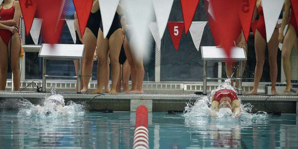 Competitors from Greenwich and Westhill-Stamford compete in a FCIAC girls swim meet in Greenwich, Connecticut on Wednesday, Oct. 25, 2017.