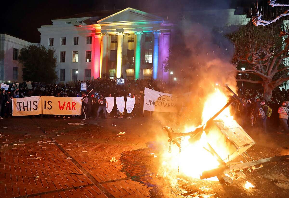 A portable light unit burns after protesters forced the cancellation of a talk by right-wing provocateur Milo Yiannopoulos at UC Berkeley in Berkeley, Calif., on Wednesday, February 1, 2017.