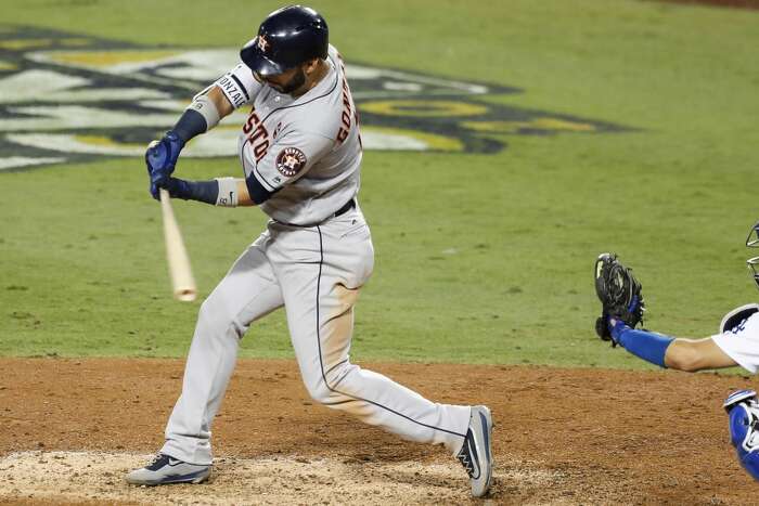 Houston Astros left fielder Marwin Gonzalez, from left, Carlos Correa and  George Springer celebrate their win against the Los Angeles Dodgers during  Game 2 of baseball's World Series Wednesday, Oc …