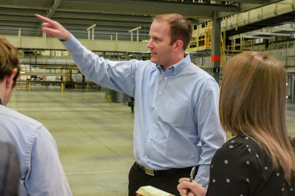 Brady Bates talks to media, inside the new FedEx Ground 800,000-square-foot automated distribution hub in Houston. Bates is senior manager of the Houston hub. (For the Chronicle/Gary Fountain, October 26, 2017)