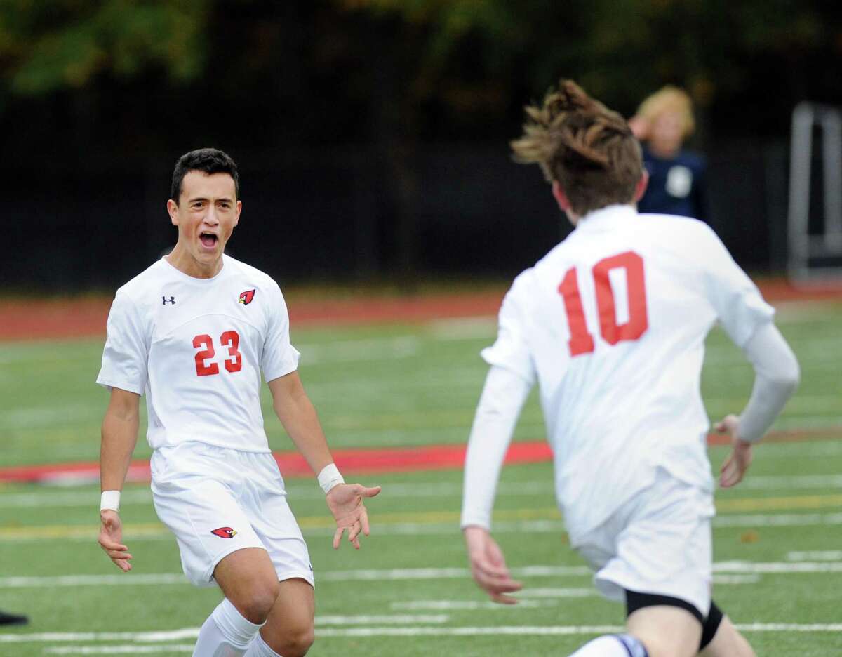 Greenwich’s Martin Garcia (23) shouts for joy over just after the goal scored by teammate Adam Juszczyk.