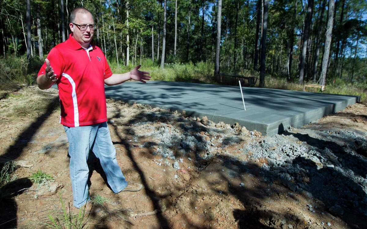 Thomas Franklin, chief operating officer for the Sam Houston Area Council, talks about the layout of campsites beside a freshly poured slab for a covered pavilion at the council's new Camp Strake, Thursday, Oct. 26, 2017, in Coldspring. The $60 million Boy Scout camp encompasses 2,816 acres in San Jacinto County, and is scheduled top open in the second quarter of 2019.