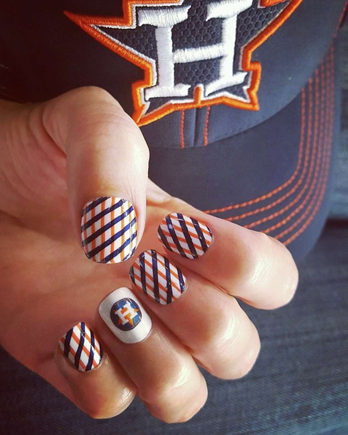 Houston Astros fans and nail artists are painting the town orange and blue