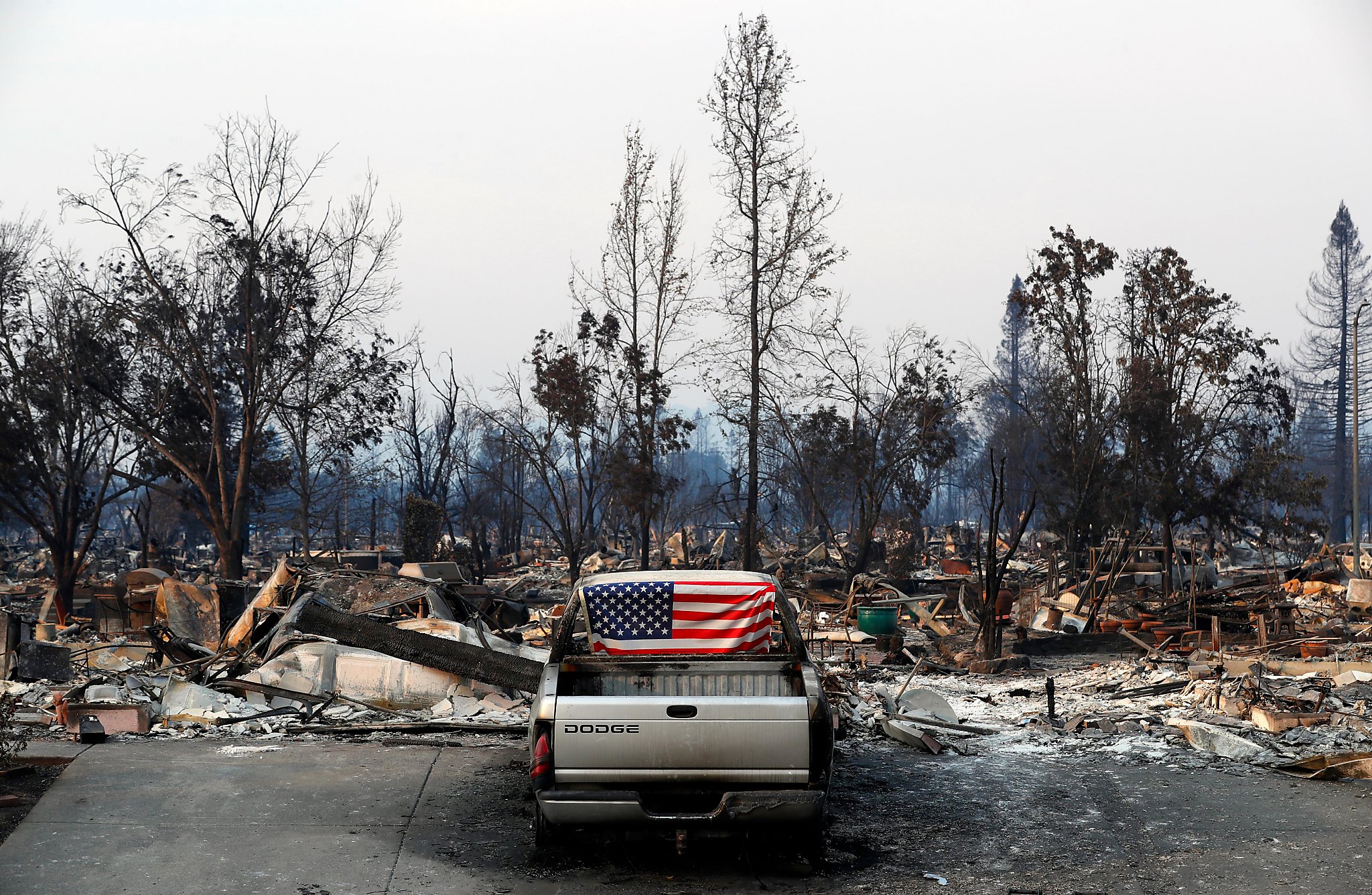Can utilities make customers pay wildfire costs? Regulators delay decision