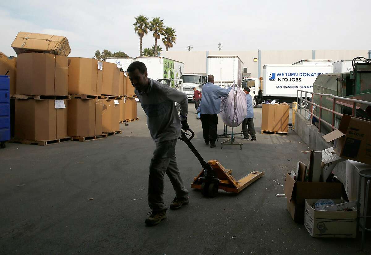 Workers at the Goodwill warehouse on Tuesday, October 17, 2017, in South San Francisco, Calif.