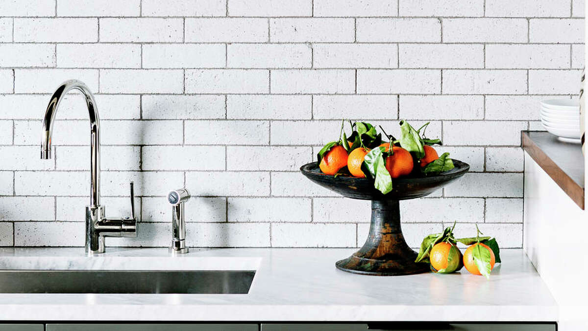 All in on Texture Glazed bricks offer the timelessness of subway tile with a little something extra: texture. Kitchens are full of smooth, glossy surfaces, so a material that contrasts that—like brick—visually balances the room. Plus, the glazes can often be custom mixed for a one-of-a-kind hue. Want even more impact out of your backsplash? Take it all the way up to the ceiling and over the range hood.