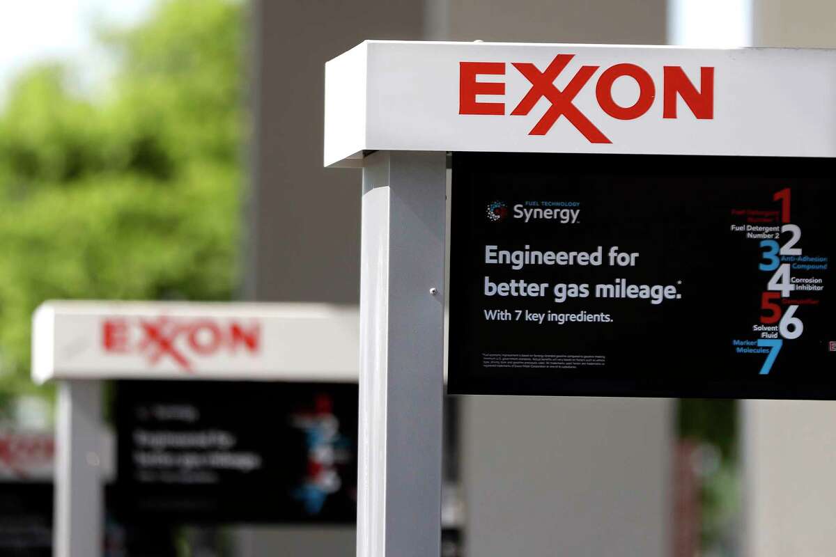 This April 25, 2017, photo, shows Exxon service station signs in Nashville, Tenn. Exxon Mobil Corp. reports earnings Friday, Oct. 27, 2017. (AP Photo/Mark Humphrey)