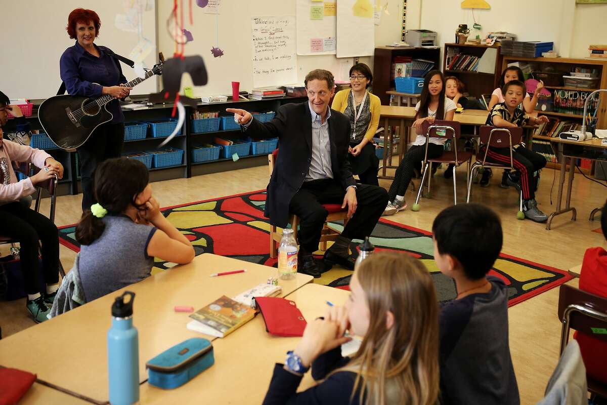 San Francisco Giants President and CEO Larry Baer talks and answers questions with the 5th grade class at Alamo School on October 11, 2017 in San Francisco, Calif.