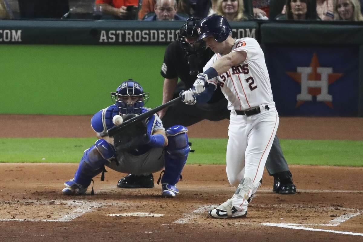 Houston Astros third baseman Alex Bregman (2) hits a sacrifice fly to center field to bring in a run during the second inning as the Houston Astros take on the Los Angeles Dodgers in Game 3 of the World Series at Minute Maid Park Friday, Oct. 27, 2017 in Houston.