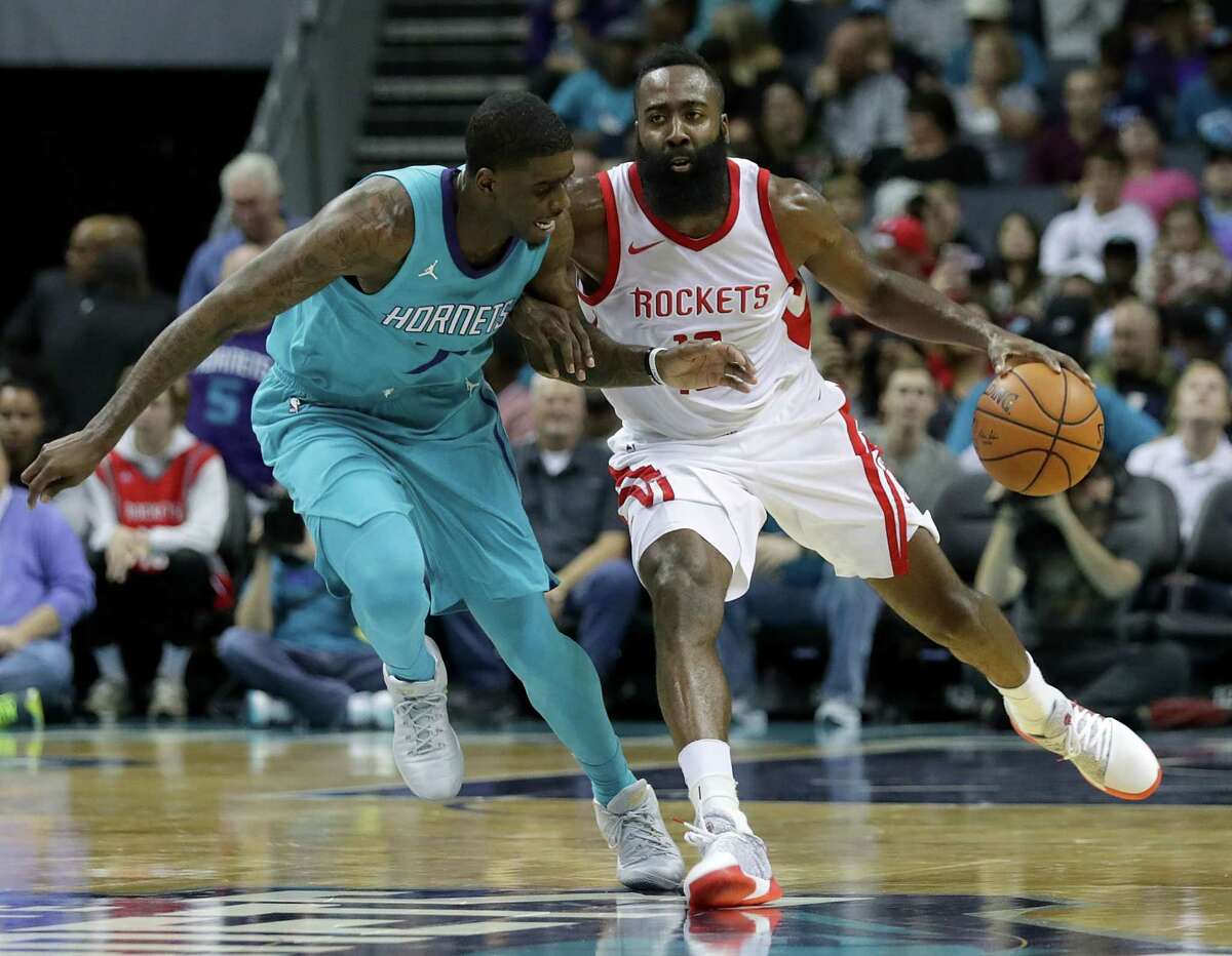 CHARLOTTE, NC - OCTOBER 27: Dwayne Bacon #7 of the Charlotte Hornets tries to stop James Harden #13 of the Houston Rockets during their game at Spectrum Center on October 27, 2017 in Charlotte, North Carolina. NOTE TO USER: User expressly acknowledges and agrees that, by downloading and or using this photograph, User is consenting to the terms and conditions of the Getty Images License Agreement. (Photo by Streeter Lecka/Getty Images)