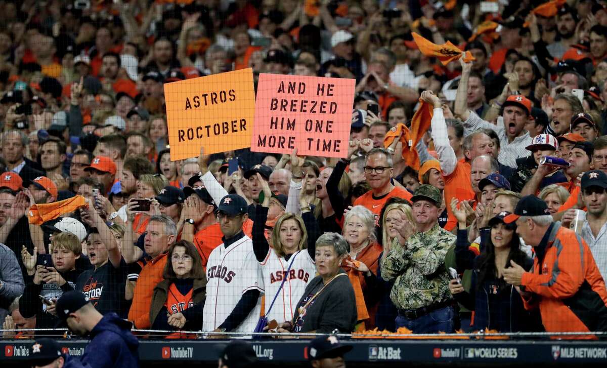 Houston Astros fans cheer during the ninth inning of Game 3 of baseball's World Series against the Los Angeles Dodgers Friday, Oct. 27, 2017, in Houston. (AP Photo/Matt Slocum)