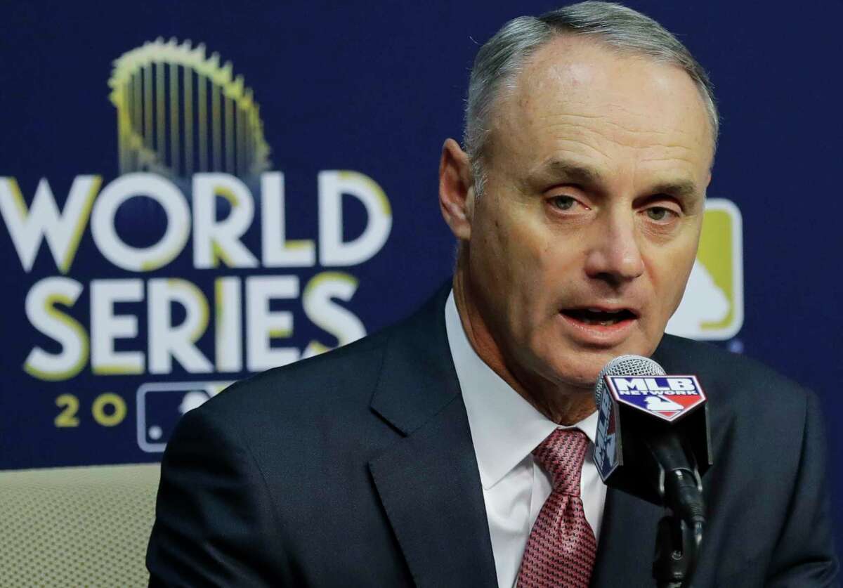 Baseball Commissioner Rob Manfred answers questions at a news conference before Game 4 of baseball's World Series between the Houston Astros and the Los Angeles Dodgers Saturday, Oct. 28, 2017, in Houston. Manfred announced that Houston Astros' Yuli Gurriel will be suspended five games without pay starting in the 2018 season. (AP Photo/David J. Phillip)