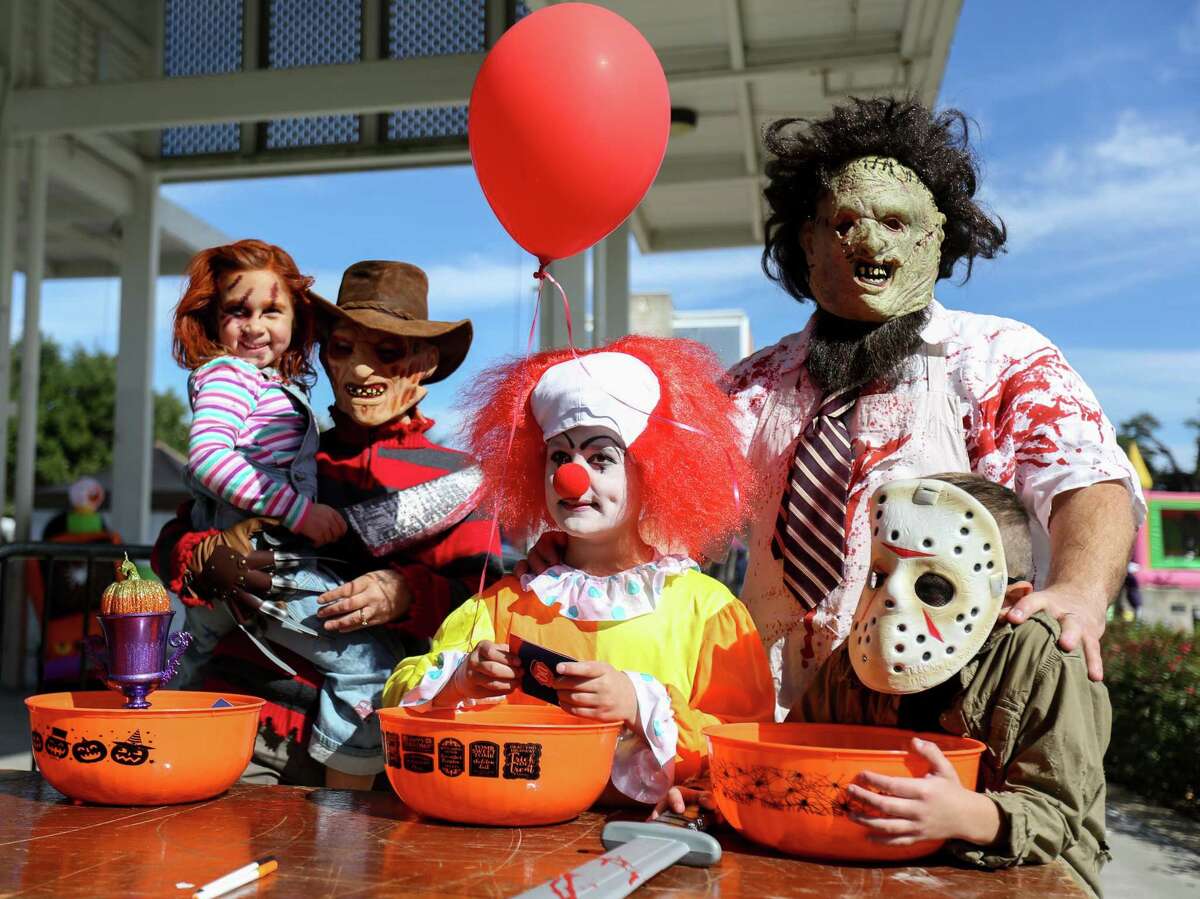 The Moon family from the left: Emery, 5, Nikki, Brett, 10, Frank and Lance, 7, pose for photos after taking first and second places in the children's costume contest during the 2nd Annual Truck or Treat Halloween Family Food Festival on Saturday, Oct. 28, 2017, in downtown Conroe.