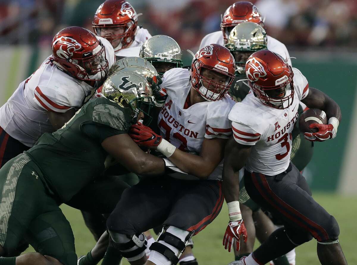 Houston running back Mulbah Car (34) runs against South Florida during the second half of an NCAA college football game Saturday, Oct. 28, 2017, in Tampa, Fla. (AP Photo/Chris O'Meara)