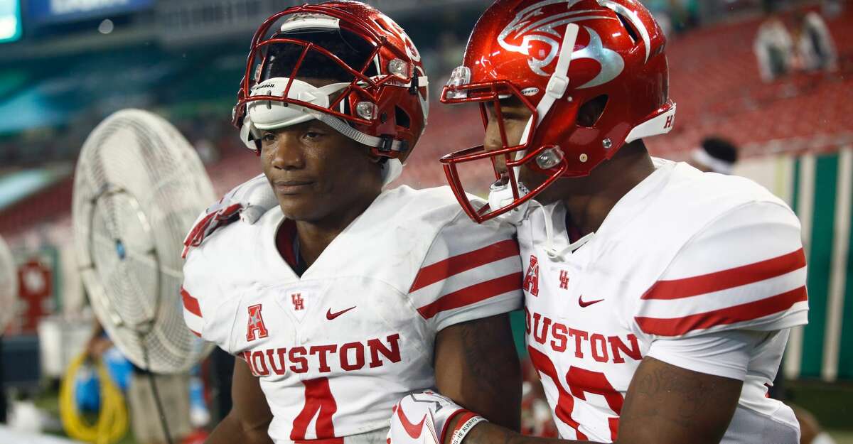 TAMPA, FL - OCTOBER 28: Quarterback D'Eriq King #4 of the Houston Cougars celebrates with wide receiver Kinte Hatton #33 following the Cougars' 28-24 win over the South Florida Bulls at an NCAA football game on October 28, 2017 at Raymond James Stadium in Tampa, Florida. (Photo by Brian Blanco/Getty Images)