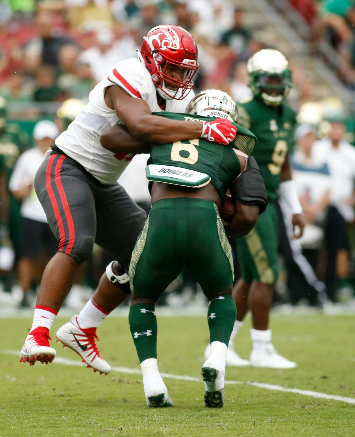 TAMPA, FL - OCTOBER 28: Defensive tackle Ed Oliver #10 of the Houston Cougars tackles running back Darius Tice #6 of the South Florida Bulls during the first quarter of an NCAA football game on October 28, 2017 at Raymond James Stadium in Tampa, Florida. (Photo by Brian Blanco/Getty Images)