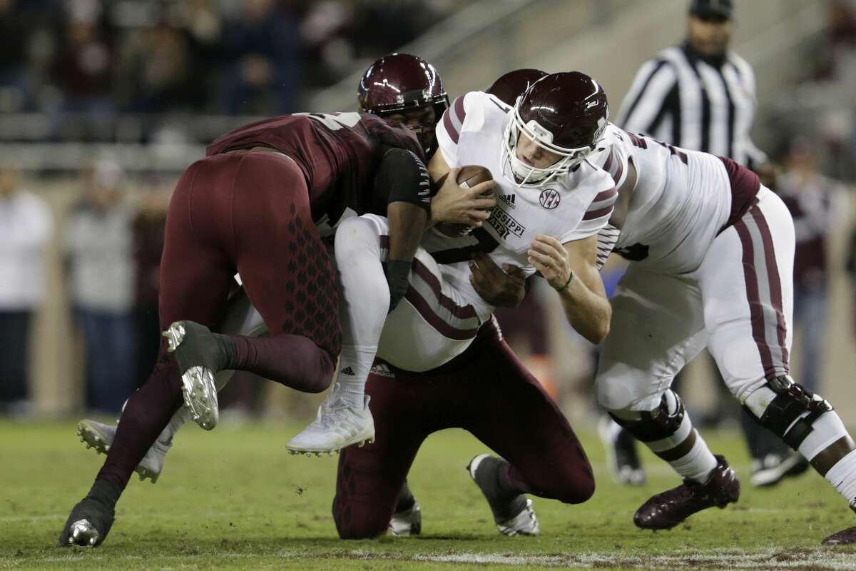 COLLEGE STATION, TX - OCTOBER 28: Otaro Alaka #42 of the Texas A&M Aggies and Jarrett Johnson #40 tackle Nick Fitzgerald #7 of the Mississippi State Bulldogs in the second quarter at Kyle Field on October 28, 2017 in College Station, Texas. (Photo by Tim Warner/Getty Images)