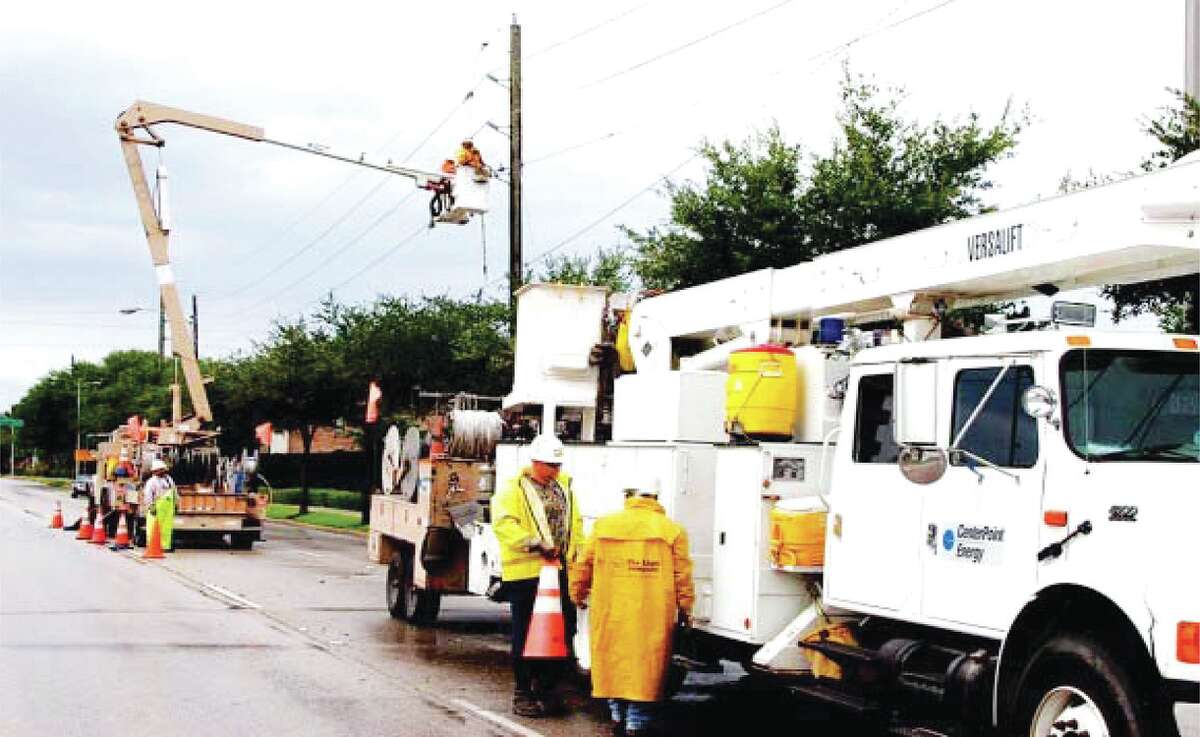 In this file photo, workers from Centerpoint Energy are seen repairing electric lines.