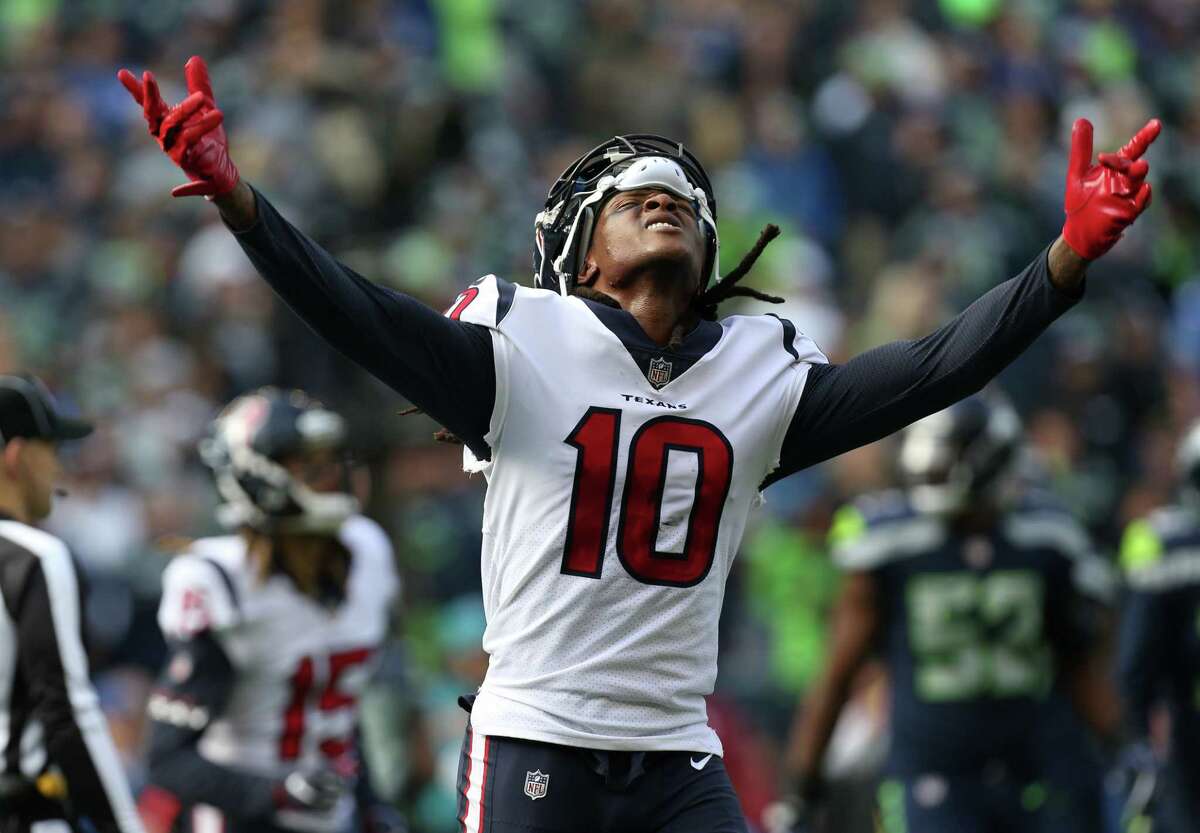 Houston Texans wide receiver DeAndre Hopkins (10) celebrates after wide receiver Will Fuller's (15) 20-yard touchdown against the Seattle Seahawks during the first half of the game at CenturyLink Field Sunday, Oct. 29, 2017, in Seattle.