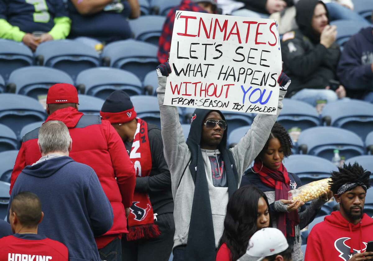 A Texans fan's sign refers to owner Bob McNair's "inmates" comment before the team played at Seattle on Sunday. The 79-year-old McNair did not attend the game because of health issues.