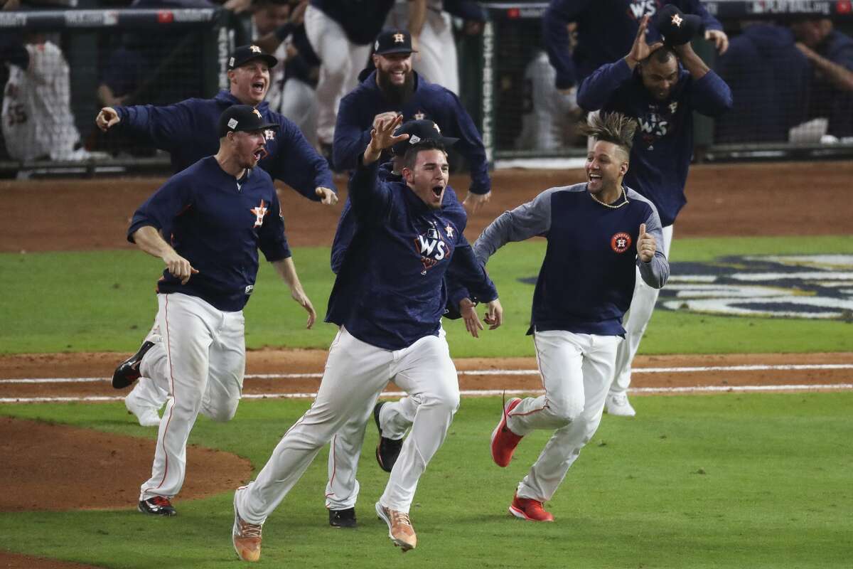 Houston Astros relief pitcher Joe Musgrove (59) and first baseman Yuli Gurriel (10) celebrate as they beat the Los Angeles Dodgers 13-12 in Game 5 of the World Series at Minute Maid Park Monday, Oct. 30, 2017 in Houston.