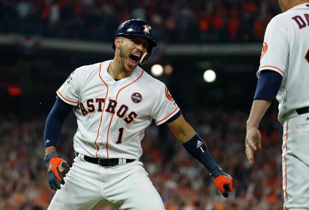 Astros shortstop Carlos Correa celebrates his two-run home run that drove in Jose Altuve during the seventh inning of Game 5 of the World Series.