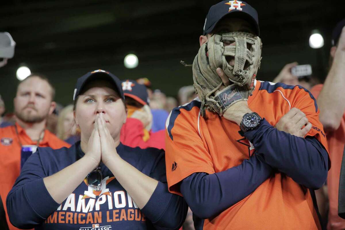 Astros fans react during Game 5 of the World Series against the Dodgers on Sunday, Oct. 29, 2017, in Houston.