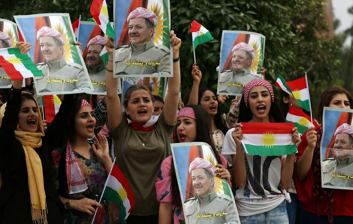 Iraqi Kurdish students of the Salahaddin University hold posters of Iraqi Kurdish leader Massud Barzani during a protest in his support in Arbil, the capital of autonomous Iraqi Kurdistan, on October 30, 2017. Long-time Kurdish leader Massud Barzani, the architect of the referendum, announced on October 29, 2017 he is stepping down after it led to Iraq's recapture of almost all disputed territories that had been under Kurdish control. / AFP PHOTO / SAFIN HAMEDSAFIN HAMED/AFP/Getty Images