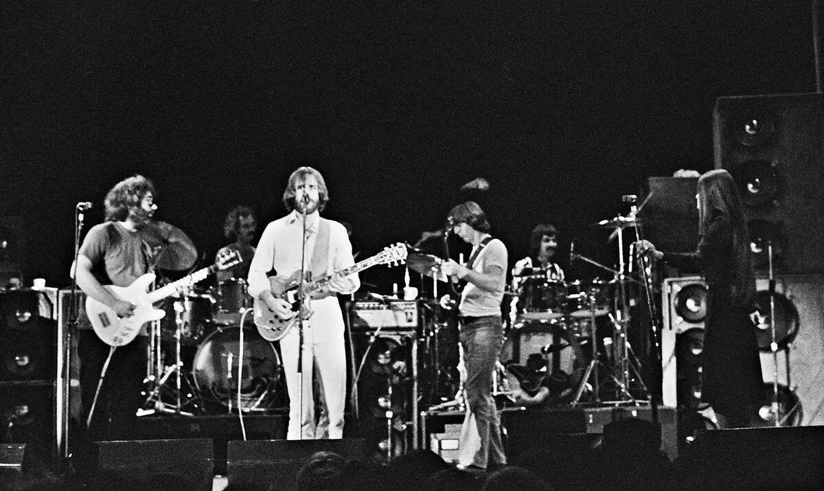In this May 8, 1977 photo provided by GDBartonHall1977.com, the Grateful Dead perform in a field house at Cornell University in Ithaca, N.Y., in what would become one of the group's most fabled shows. From left are Jerry Garcia, Bill Kreutzmann and Bob Weir, Phil Lesh, Mickey Hart and Donna Godchaux. (Lawrence Reichman/GDBartonHall1977.com via AP)