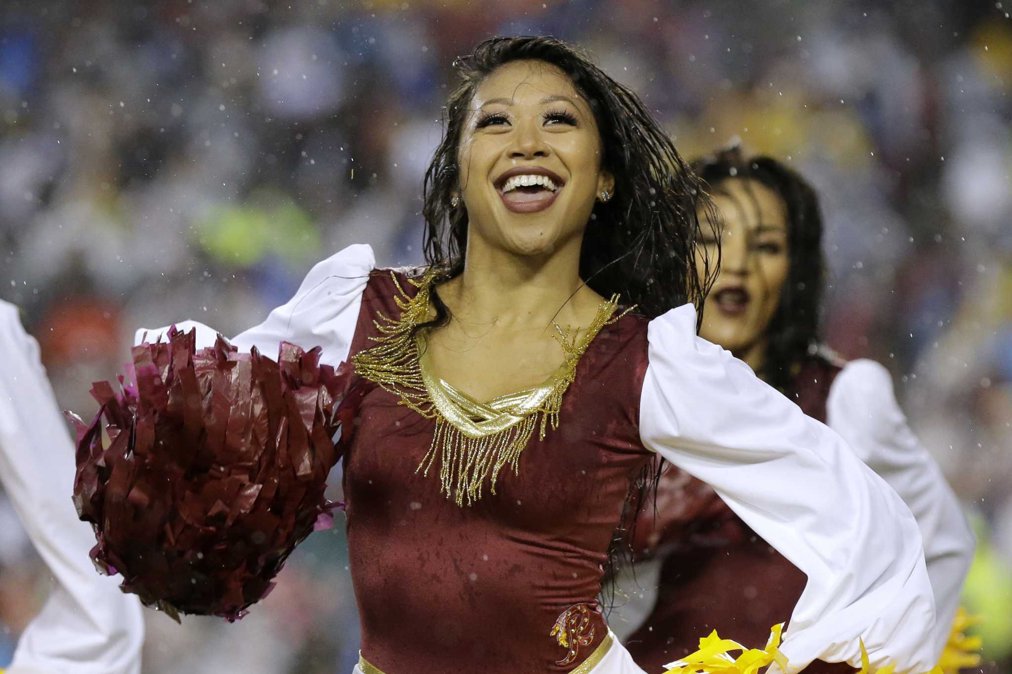 An Arizona Cardinals cheerleader performs in a Halloween costume