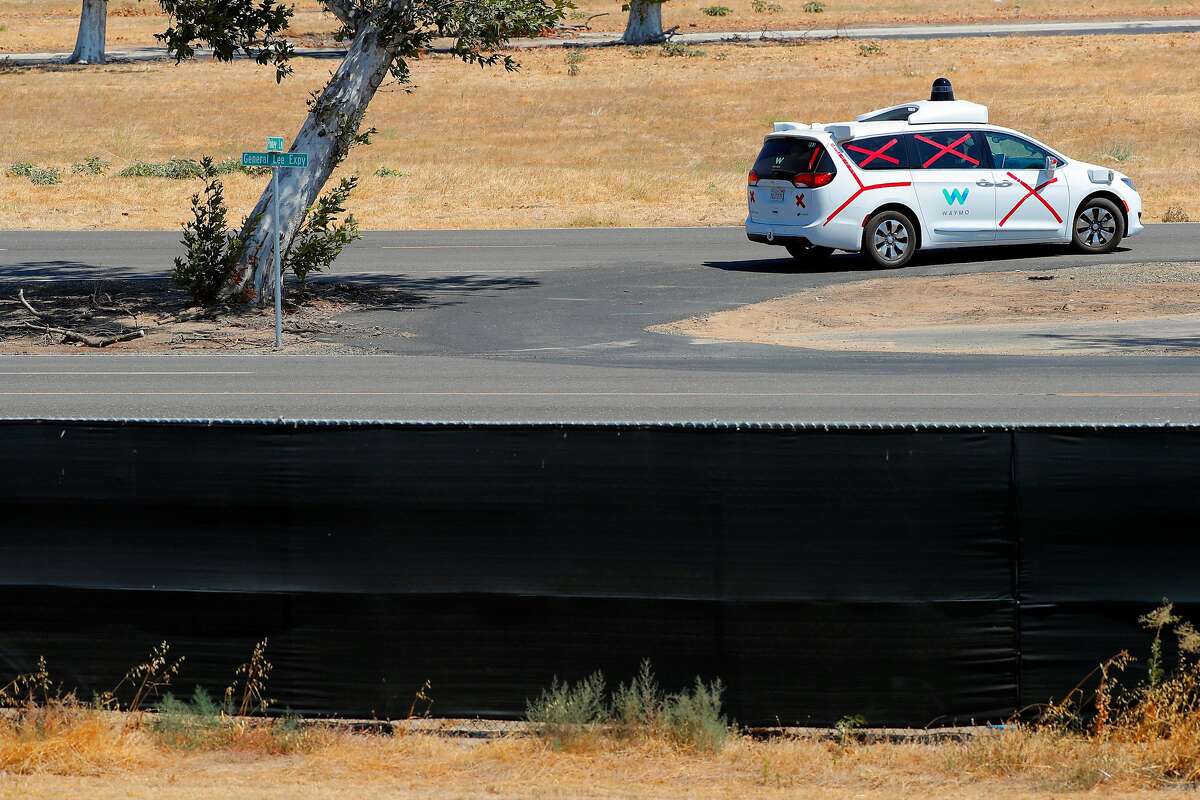 A Waymo car is tested on the former Castle Air Force base in Merced County. Waymo is the first company in California allowed to test robot cars on public roads with no human driver behind the steering wheel, it said Tuesday.