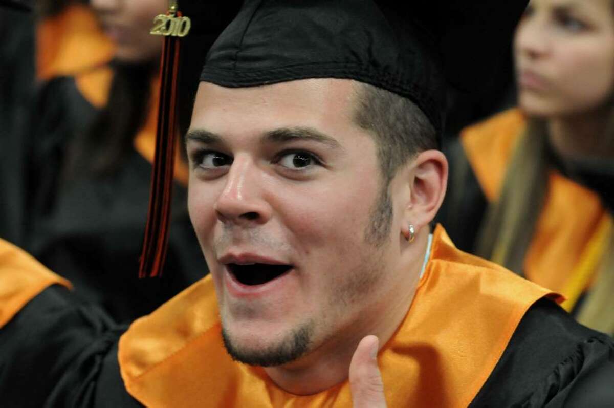Ridgefield High School graduate Drew Arcoleo gives the thumbs-up after receiving his diploma during the commencement ceremony on Friday June 25, 2010 at the Western Connecticut State University's O'Neill Center.