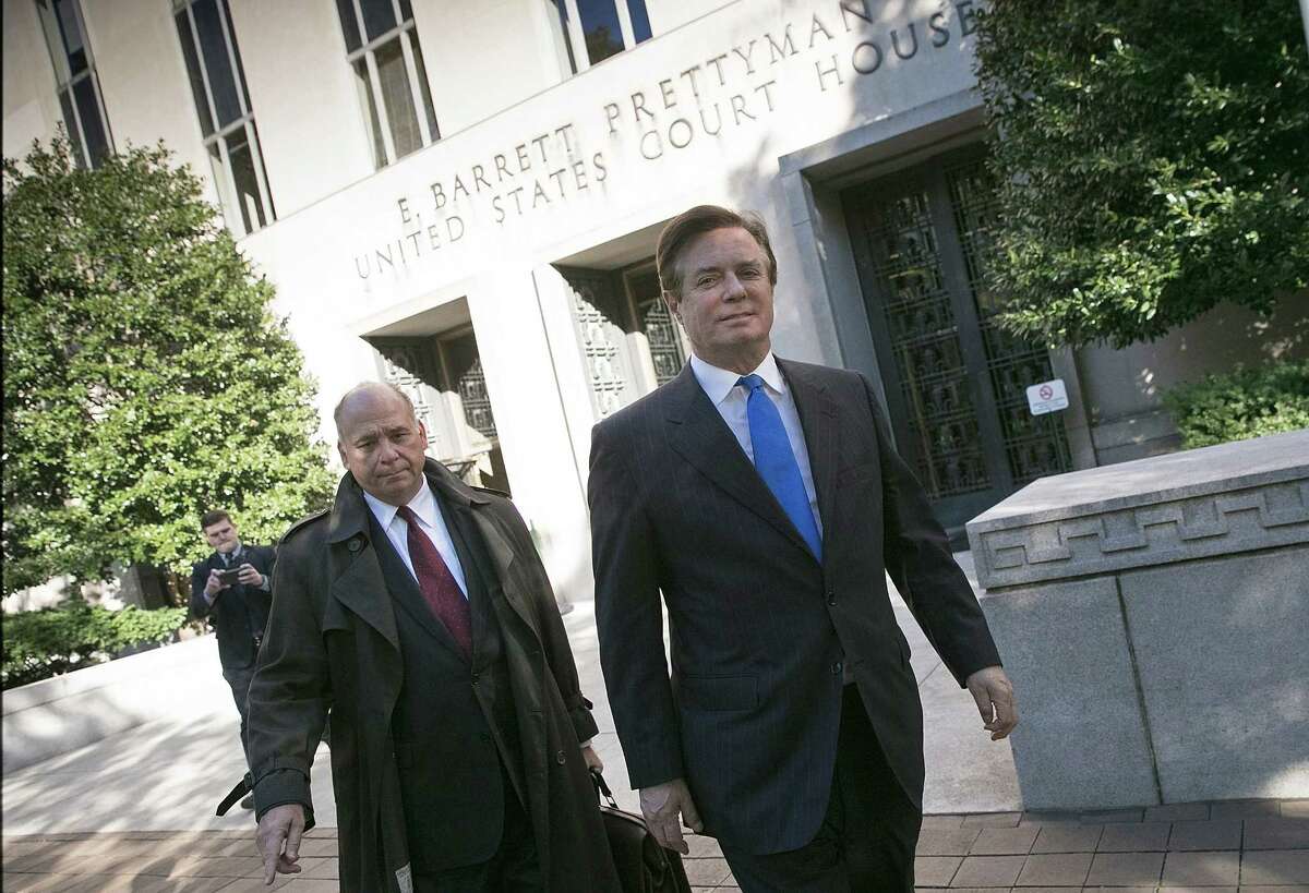 Former campaign manager for President Donald Trump, Paul Manafort, right, leaves U.S. District Court Monday after pleading not guilty following his indictment on federal charges. (Photo by Win McNamee/Getty Images)