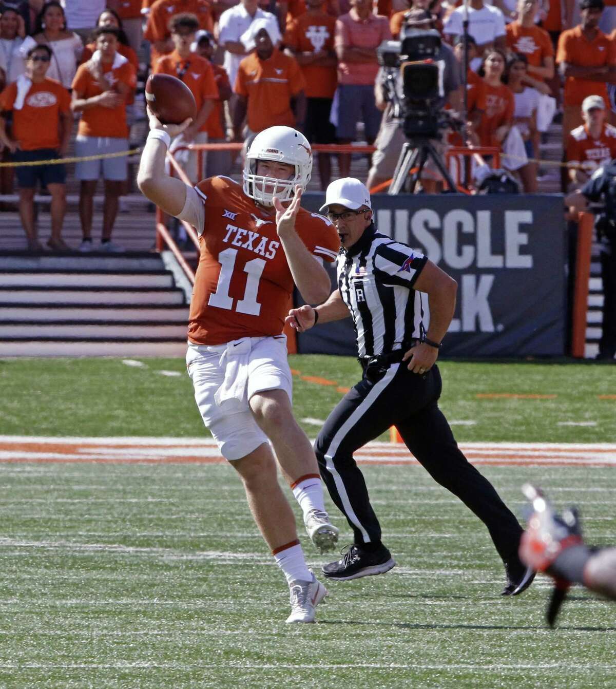 Longhorns quarterback Sam Ehlinger passes the ball against Oklahoma State on Oct. 21 in Austin.