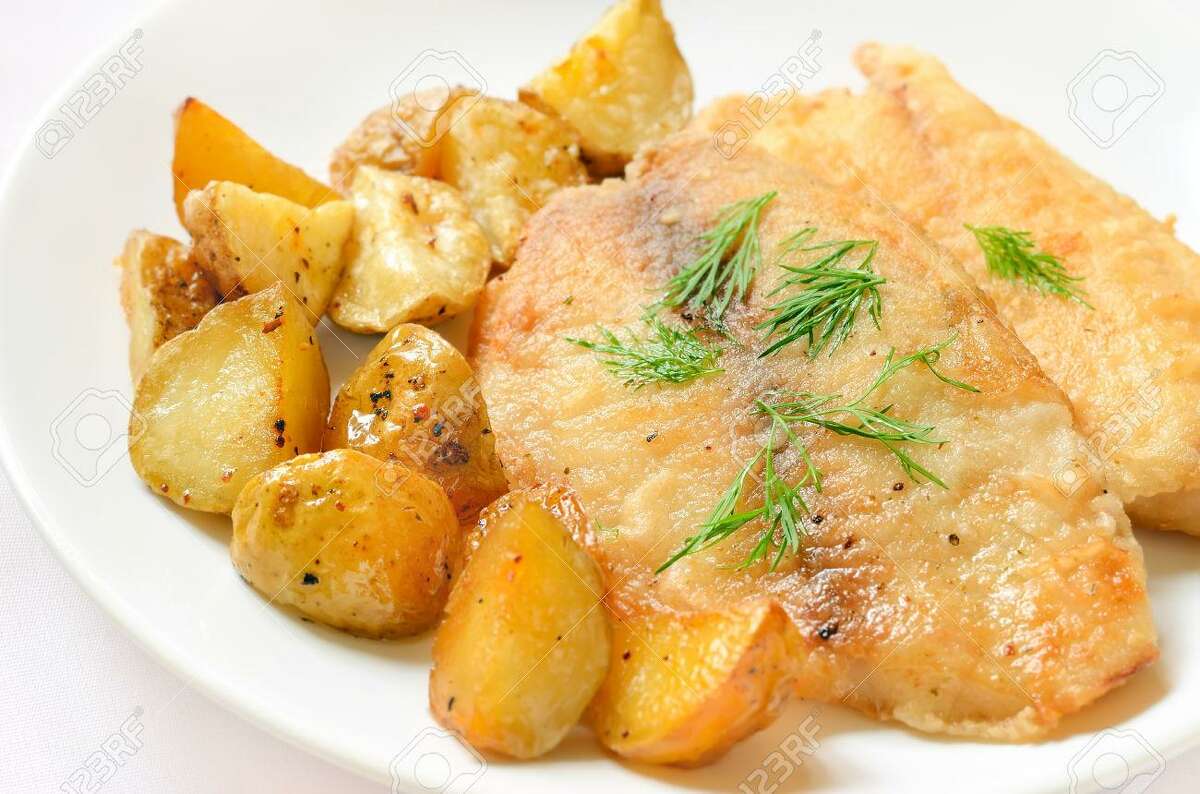 Fried fish fillet with baked potatoes