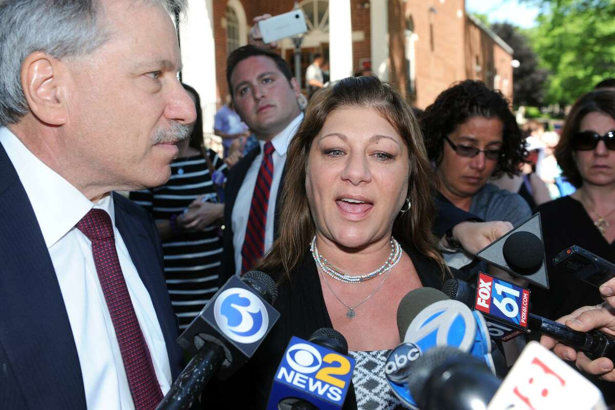 Donna Sanchez, mother of Maren Sanchez, speaks in front of Milford Superior Court following the sentencing of Christopher Plaskon in Milford, Conn. June 6, 2016. Plaskon was sentenced to 25 years in prison for the 2014 murder of Maren Sanchez at Jonathan Law High School, where the two were classmates. Sanchez is seen here with her attorney, David Golub.