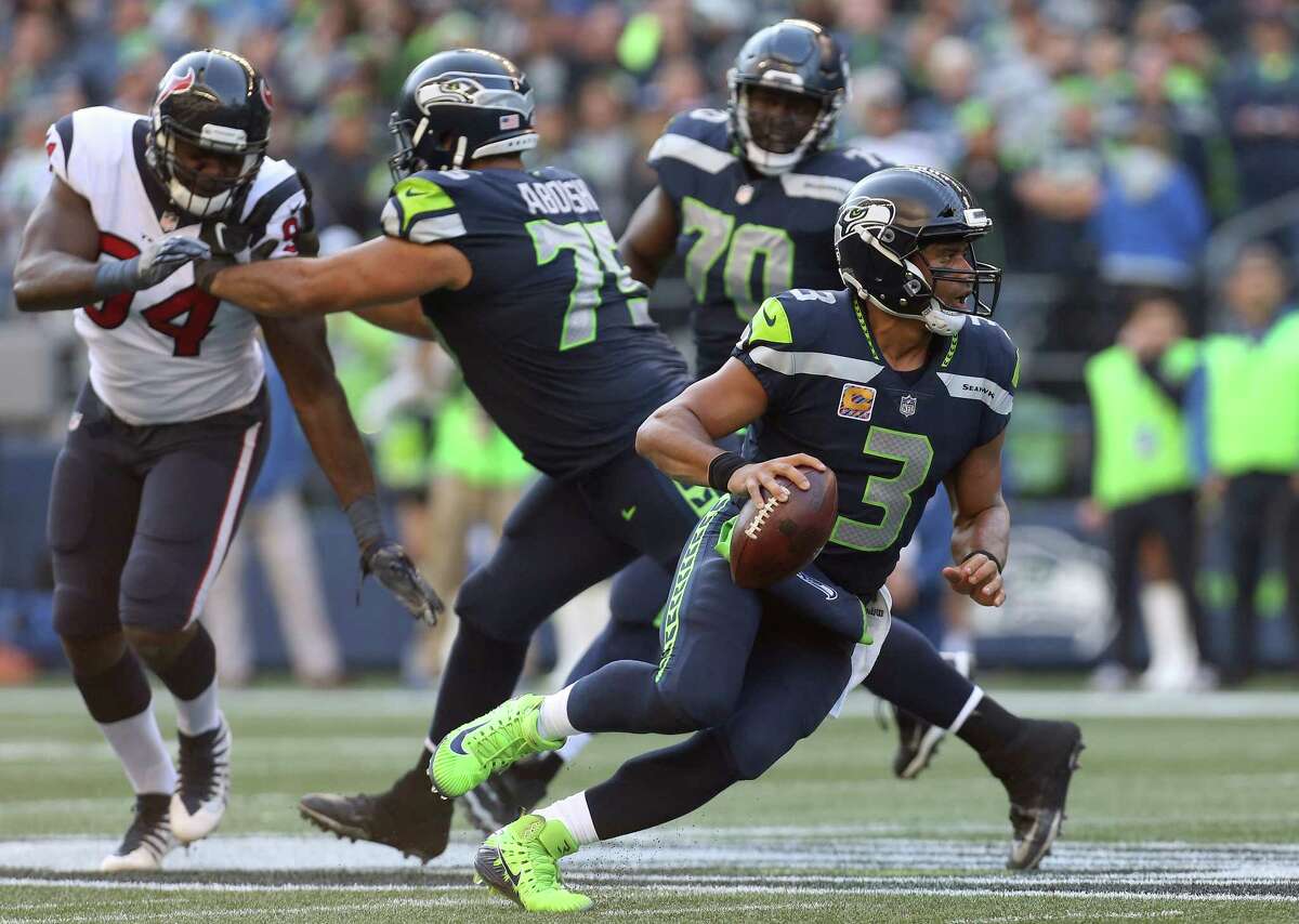Seattle Seahawks quarterback Russell Wilson (3) scrambles out of the pocket against the Houston Texans during the second half of the game at CenturyLink Field Sunday, Oct. 29, 2017, in Seattle. The Seahawks won 41-38.