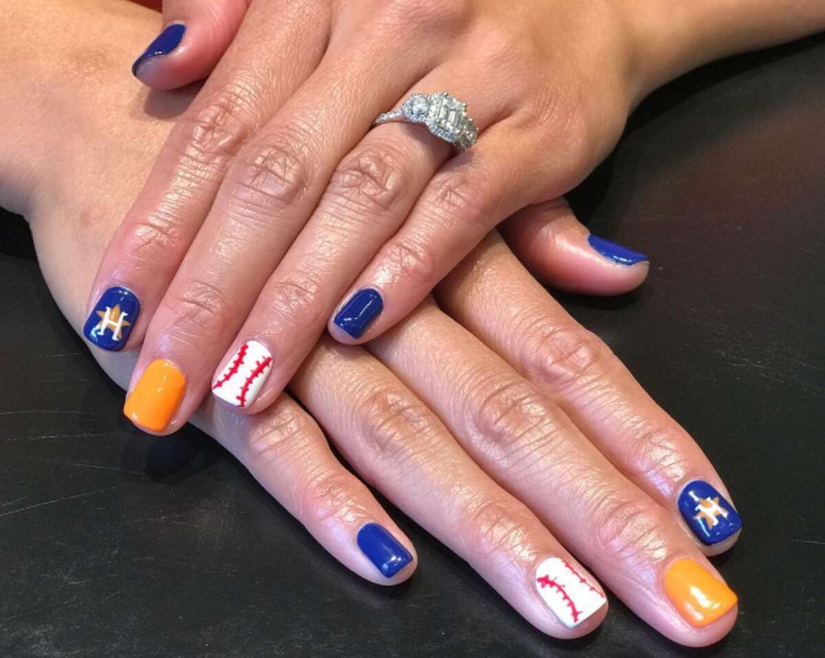 Houston Astros fans and nail artists are painting the town orange and blue