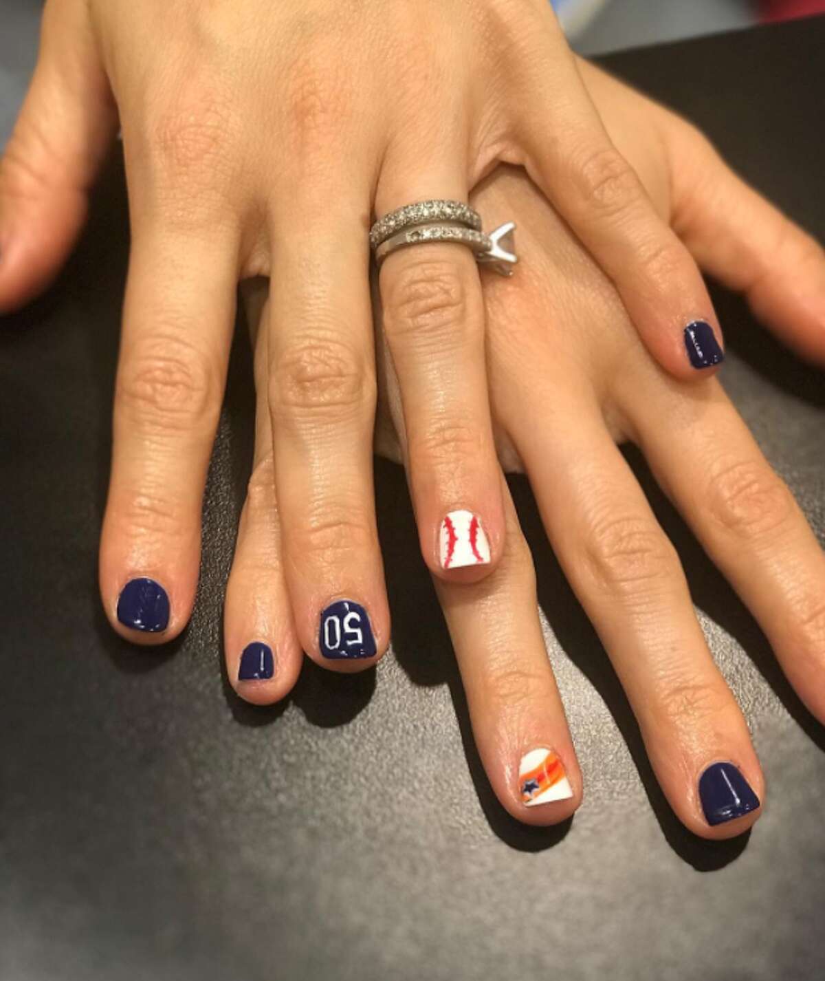 Houston Astros fans and nail artists are painting the town orange and blue