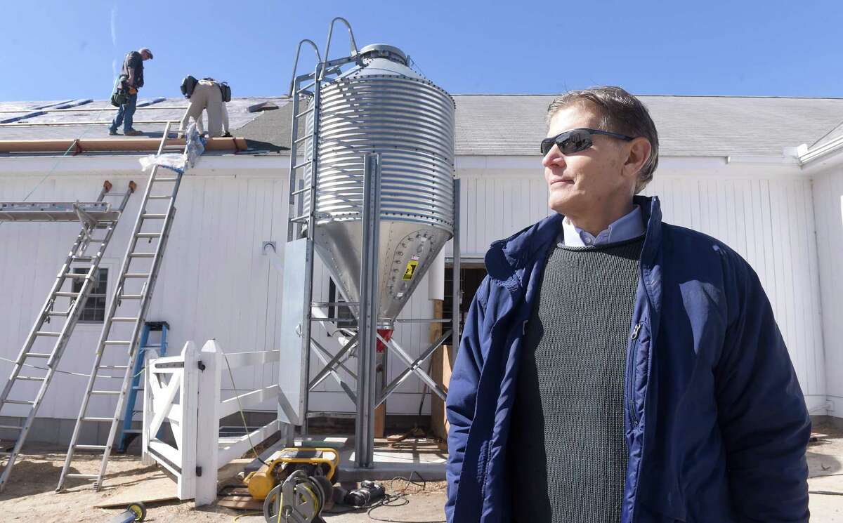 Tony Yurgaitis, co-owner of Arethusa Farm in Litchfield, is photographed by a barn undergoing expansion in this 2016 file photo.