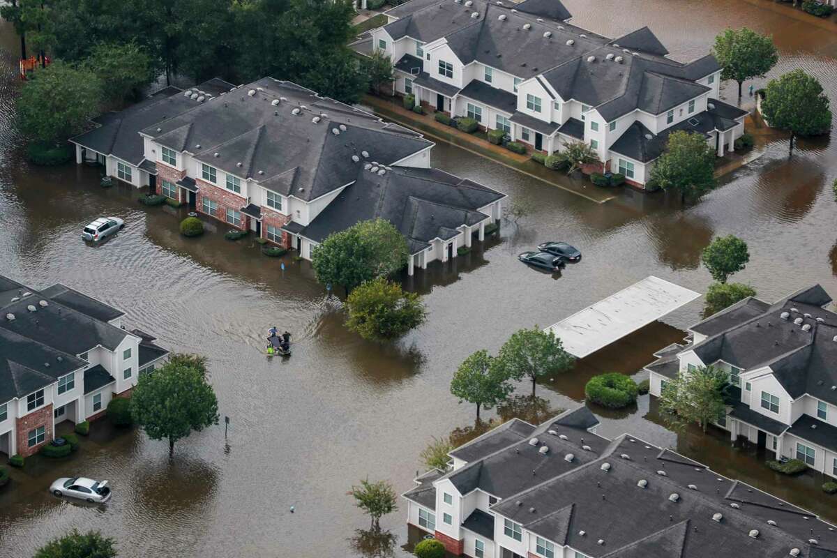 A boat floats in an apartment complex off Rayford Road flooded by Hurricane Harvey. Nearly 11,000 apartments were rented in the Houston region between the end of August and the end of September. That is typically the amount rented in an entire year. Apartment demand has continued in October.