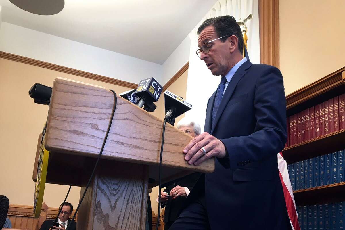 Connecticut’s longest budget impasse ended quietly Tuesday afternoon when Gov. Dannel P. Malloy signed the bill into law.