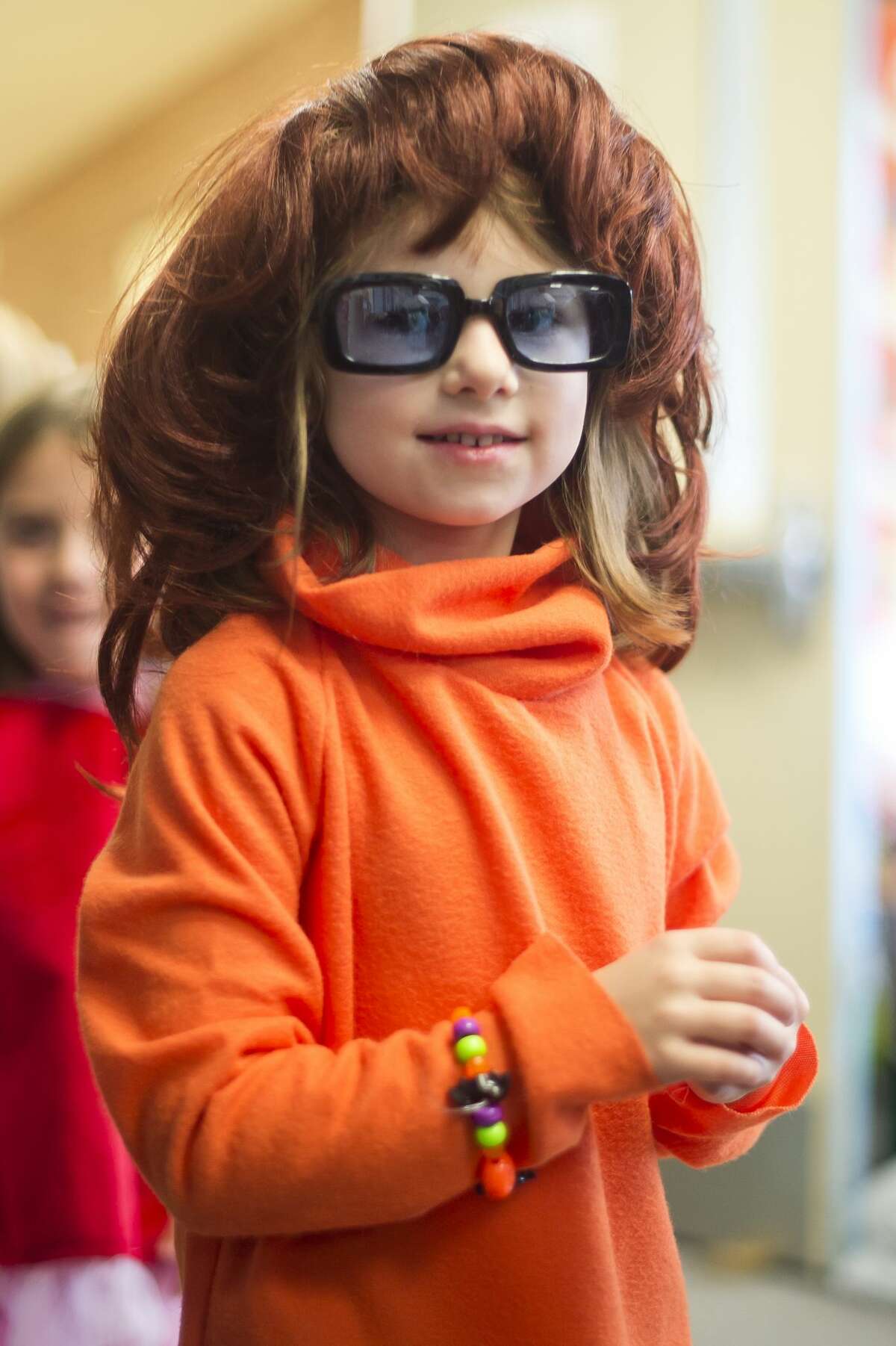 Students and faculty at Adams Elementary take a break from class to parade through the halls in their Halloween costumes on Tuesday, Oct. 31, 2017. (Katy Kildee/kkildee@mdn.net)