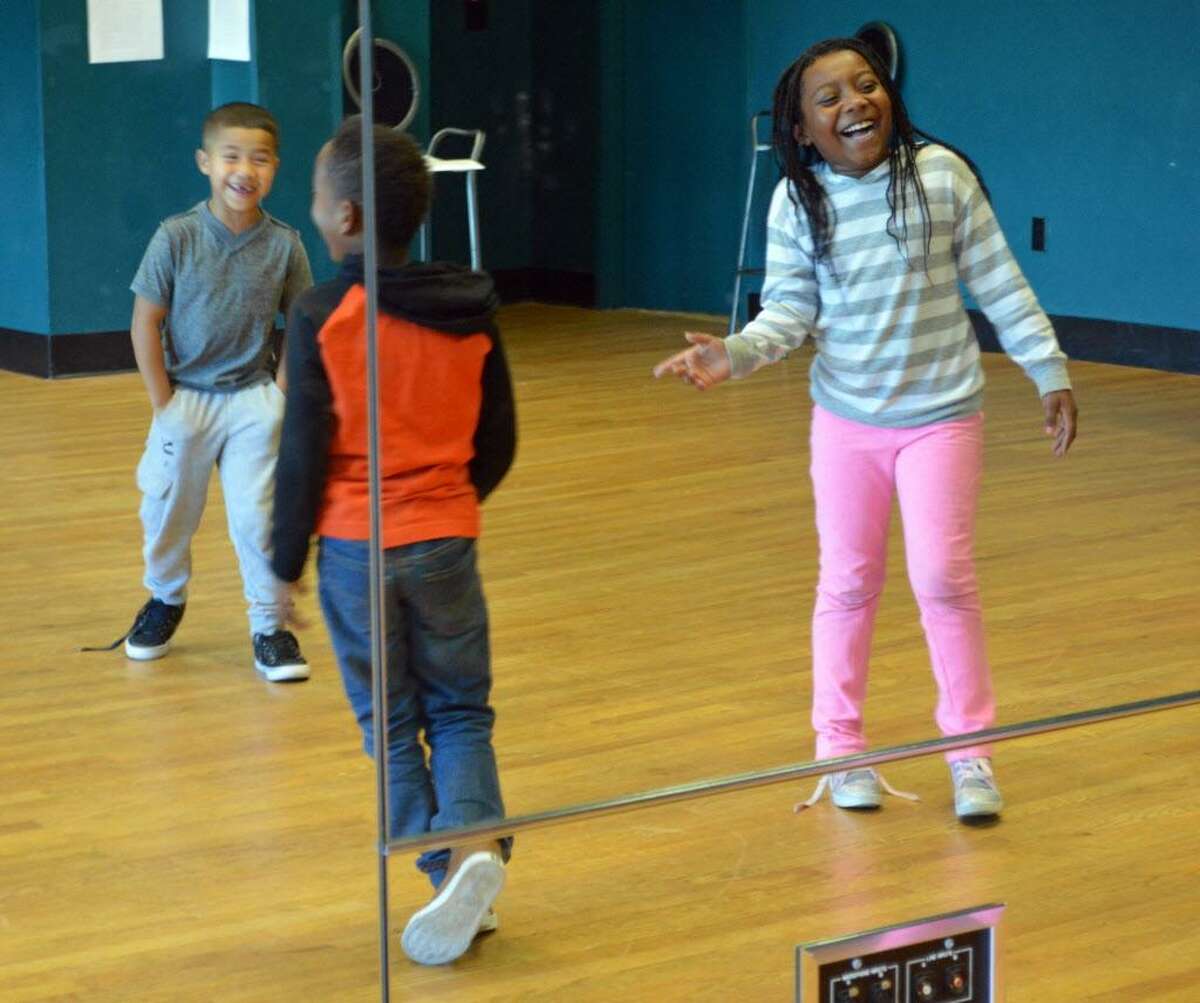 Grade one to three students in the beginning hip hop class at the Green Street Teaching and Learning Center in Middletown dance to the Black-Eyed Peas’ “I’ve Gotta Feeling” Monday afternoon in the performance studio.