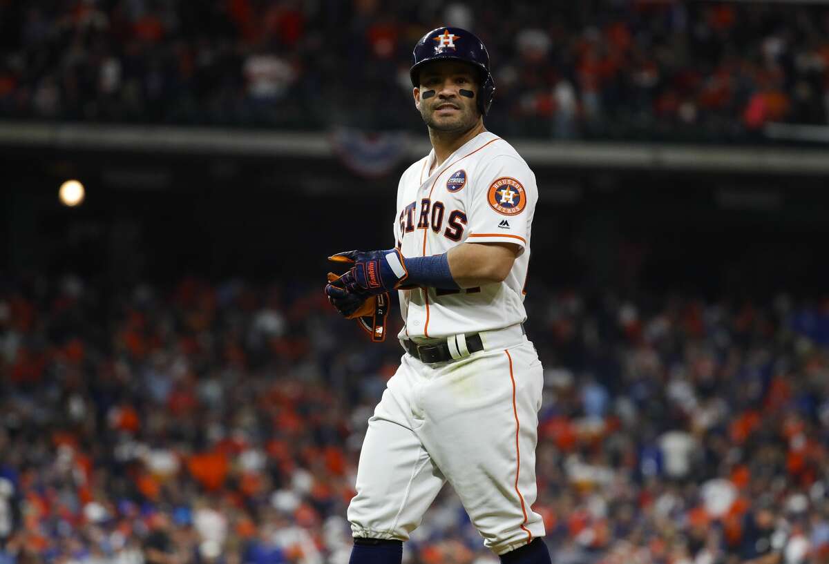 Houston Astros second baseman Jose Altuve (27) walks back to the dugout after flying out to end the ninth inning of Game 4 of the World Series at Minute Maid Park on Saturday, Oct. 28, 2017, in Houston.