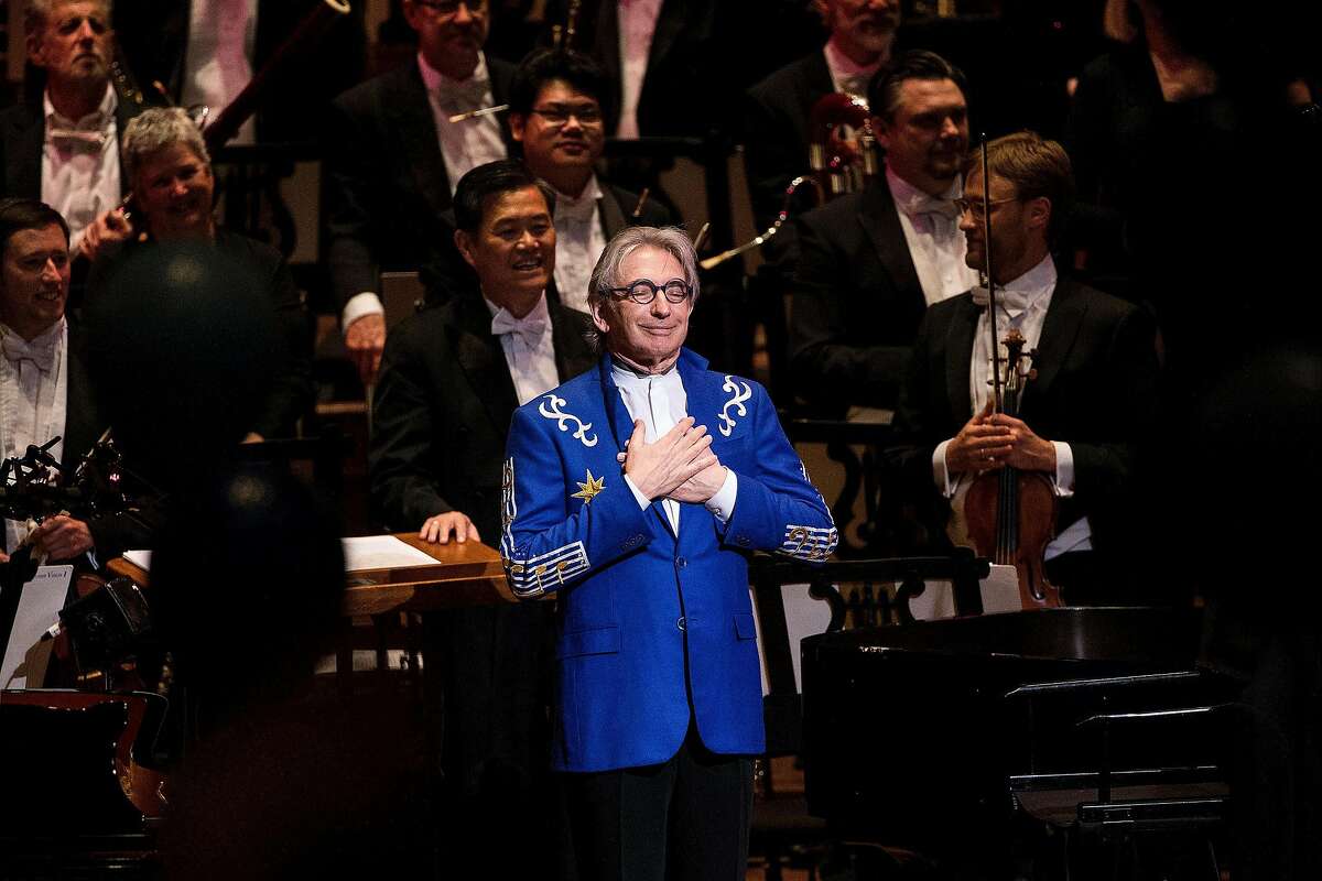 Michael Tilson Thomas, music director of the San Francisco Symphony, center, reacts as the audience sung "Happy Birthday" during his 70th Birthday Gala celebration at Louise M. Davies Symphony Hall in San Francisco, Calif. on Thursday, Jan. 15, 2015.